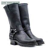 A pair of black leather mid-calf boots with a pebbled texture, featuring a buckle strap detail on the side and a rugged lug sole, shown against a plain white background.