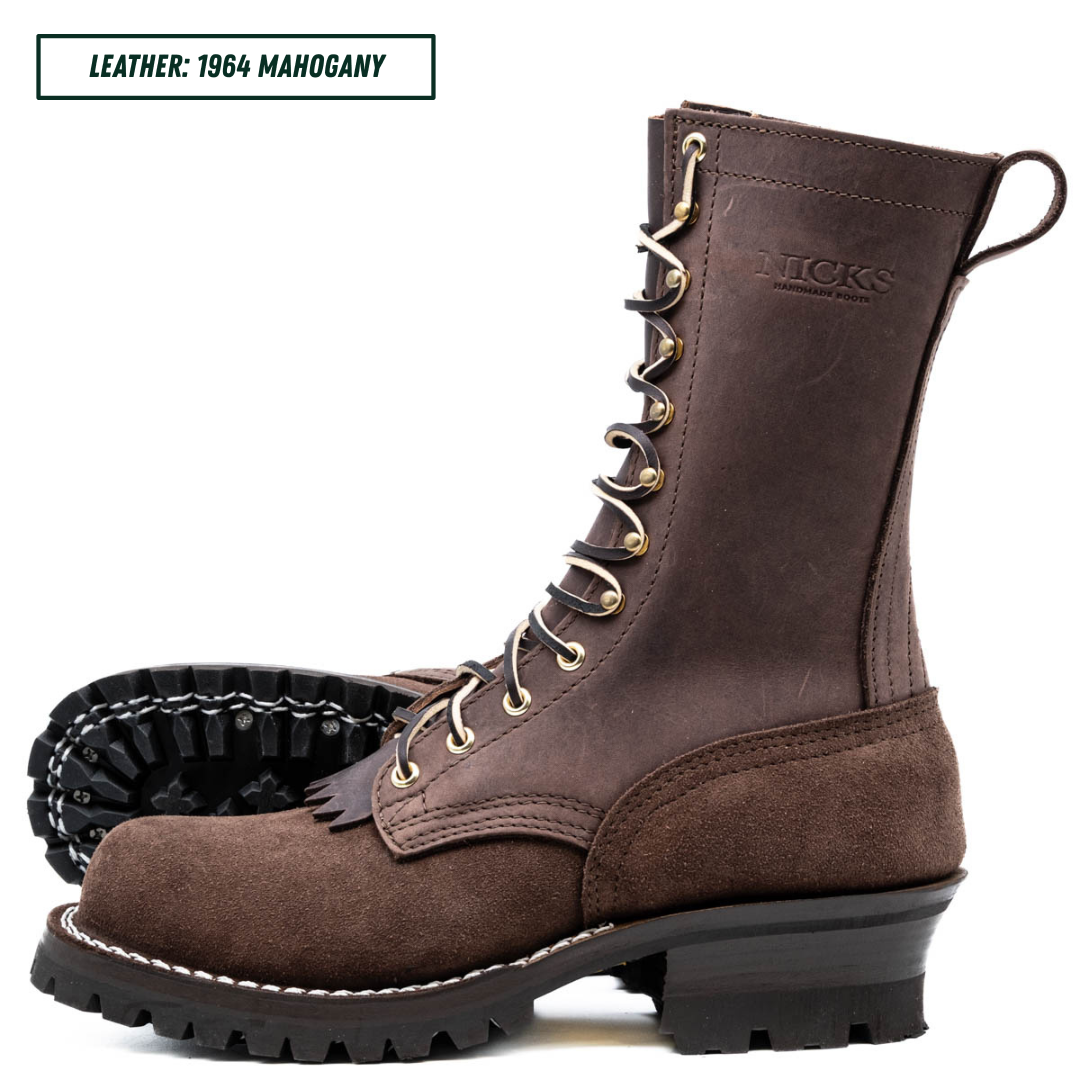 A dark brown lace-up work boot made of leather, shown from the side with a second boot behind it showing the black sole. The top left corner has a text label reading 'LEATHER: 1964 MAHOGANY'.