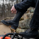 A person outdoors wearing a black leather lace-up boot and tying the laces, with another black boot on the other foot. Logs and a blurred forest background are visible, with a text overlay reading 'LEATHER: MAX SUPPORT BLACK' in the top left corner.