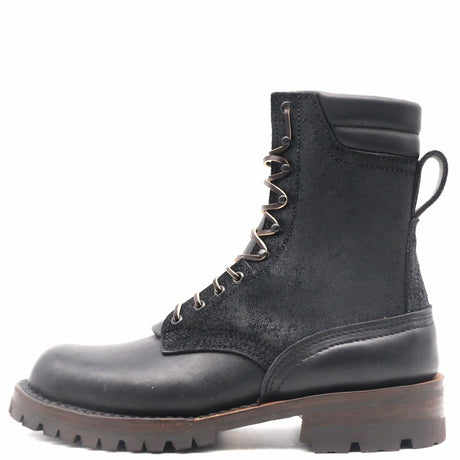 A black leather lace-up ankle boot with a rugged lug sole and metal eyelets, shown from a side profile on a white background.
