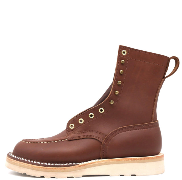 Brown eight inch boot with brass grommets and a white wedge outsole in front of a white background.