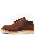 A brown leather lace-up ankle boot with cream-colored stitching and a thick off-white sole, shown from a side profile on a white background.