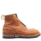 Brown leather boot with visible stitching on a white background
