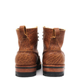 Pair of brown leather boots on a white background