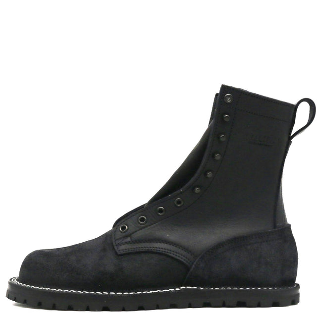 A black leather and suede lace-up ankle boot with metal eyelets, white contrast stitching along the sole, and a pull tab at the heel, shown from a side profile on a white background.