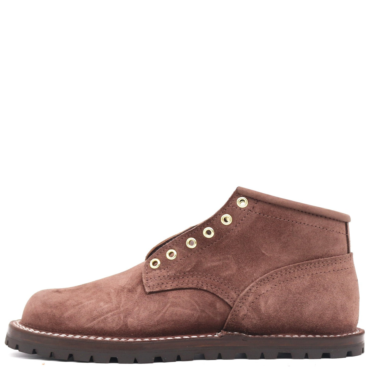 A brown suede ankle boot with gold-tone metal eyelets, a dark brown sole, and white contrast stitching, shown from a side profile on a white background.