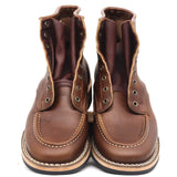 A pair of brown leather lace-up ankle boots with contrast stitching, set against a plain white background.