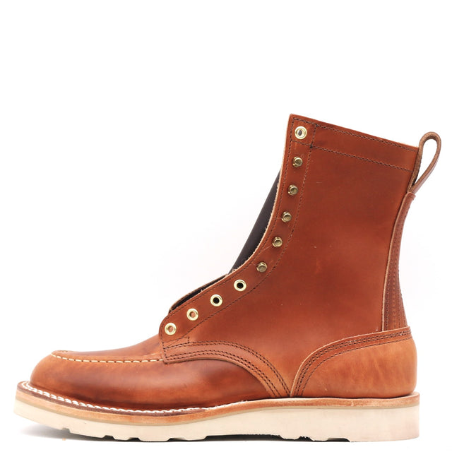 A single brown leather lace-up ankle boot with brass eyelets, a pull tab, and a thick off-white sole, shown from a side profile on a white background.