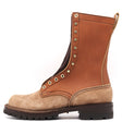 A mid-calf lace-up boot in tan and brown leather with brass eyelets, a dark brown sole, and a pull tab at the heel, shown from a side profile on a white background.