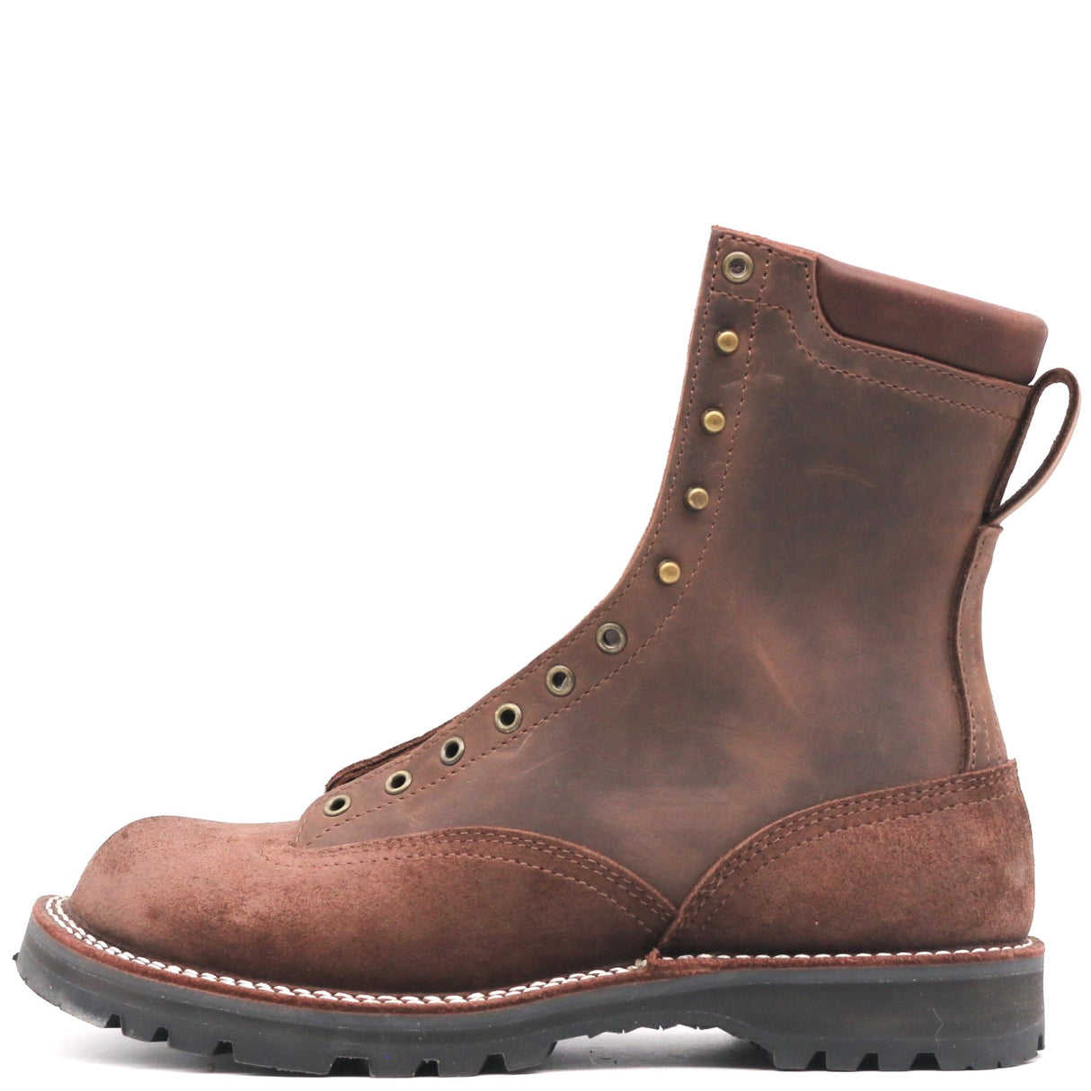 A brown leather lace-up work boot with brass eyelets, a pull tab, and a thick black lug sole, shown from a side profile on a white background.