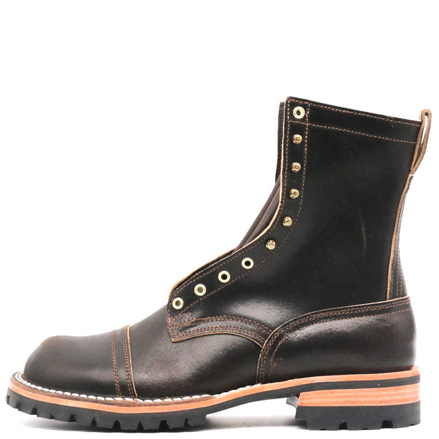 A dark brown leather lace-up ankle boot with brass eyelets, a black lug sole, and a light tan midsole layer, shown from a side profile on a white background.