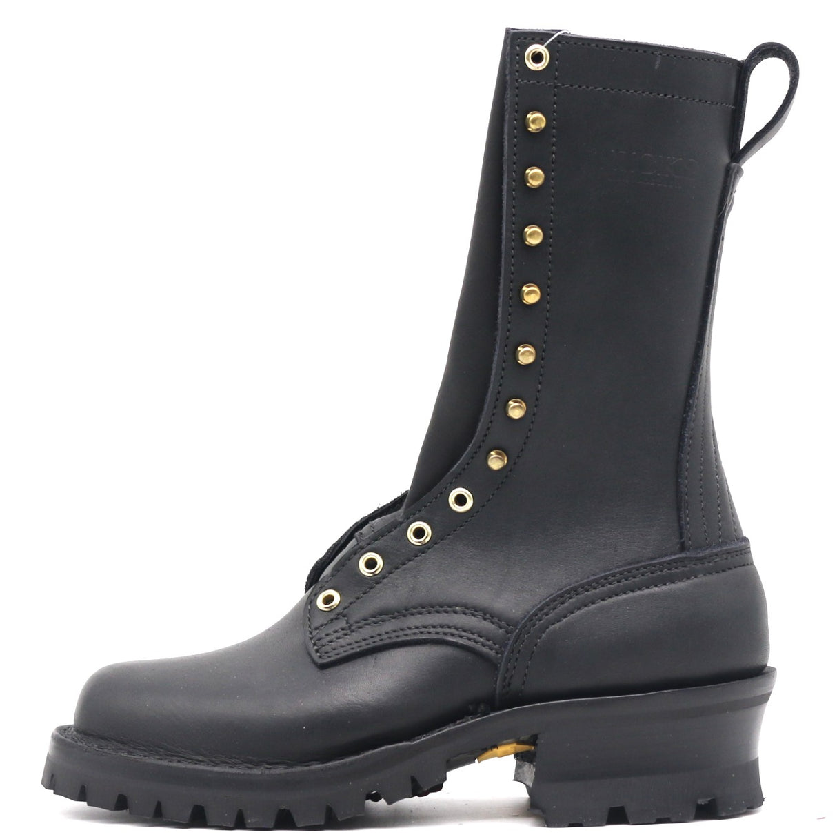 A black leather lace-up combat boot with gold-tone metal eyelets and studs, a thick lug sole, and a pull tab at the heel, shown from a side profile on a white background.