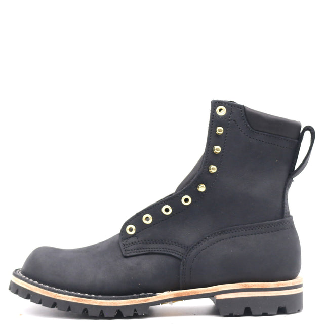 A black suede lace-up ankle boot with gold-tone metal eyelets and studs, a pull tab at the heel, and a rugged black lug sole with a light tan midsole stripe, shown against a plain white background.