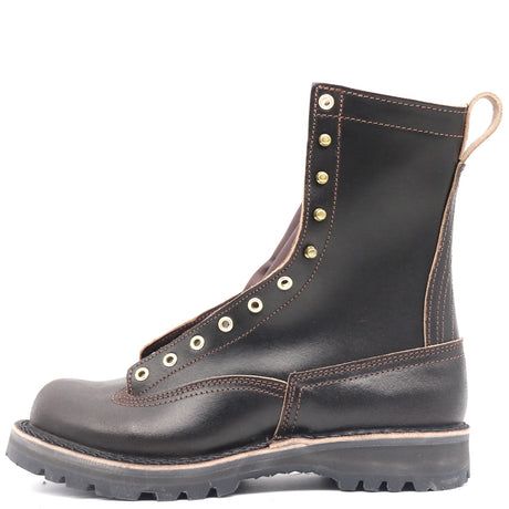 A dark brown leather lace-up boot with gold-tone metal eyelets and a thick black lug sole, shown from a side profile on a white background.