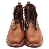 A pair of brown leather lace-up ankle boots with gold-tone eyelets and white contrast stitching, photographed against a plain white background.