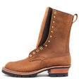 Brown ten inch boot with brass hardware and a lug outsole over a white background.