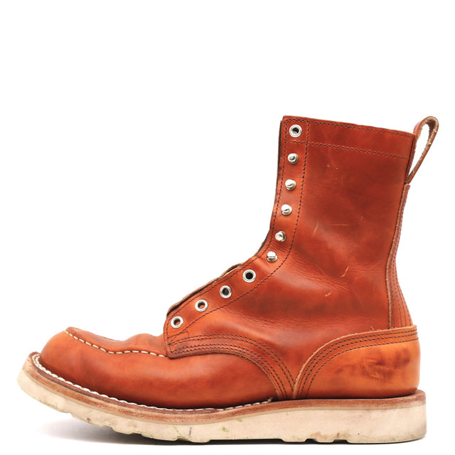 A single brown leather lace-up ankle boot with silver metal eyelets and a thick off-white sole, shown from a side profile on a white background.