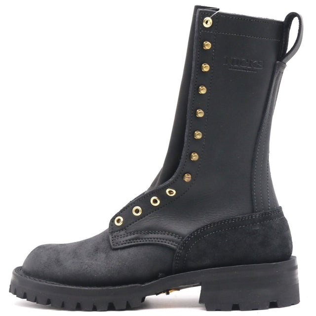A black mid-calf lace-up boot with gold-tone metal eyelets and studs, featuring a thick black lug sole and a pull tab at the heel, shown against a plain white background.