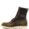 A single lace-up ankle boot in dark brown pebbled leather and olive green suede, featuring brass eyelets and a thick off-white sole, shown against a plain white background.