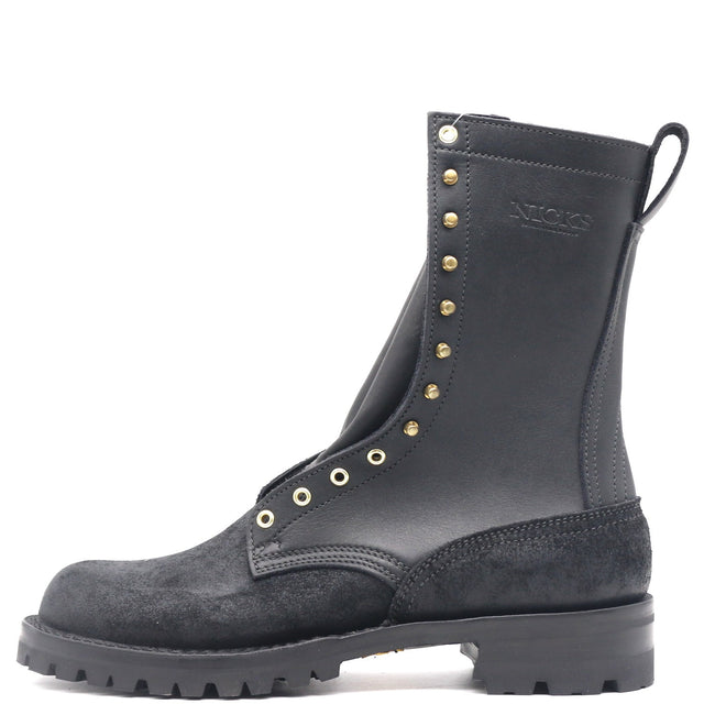 A black leather and suede ankle boot with gold-tone metal eyelets and studs, featuring a pull tab at the heel, shown against a plain white background.