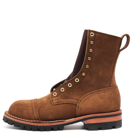 A brown suede lace-up ankle boot with brass eyelets, a pull tab, and a black lug sole, shown from a side profile on a white background.