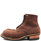 A single brown leather lace-up boot with a cap toe, brass eyelets, and a stacked wood-look heel, shown in profile against a plain white background.
