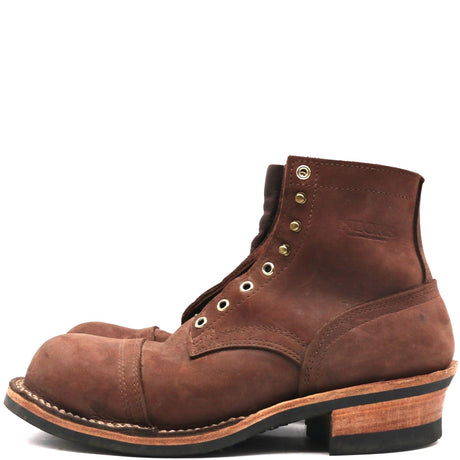 A single brown leather lace-up boot with a cap toe, brass eyelets, and a stacked wood-look heel, shown in profile against a plain white background.