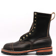 A single dark brown leather lace-up boot with brass eyelets, contrast stitching, and a rugged lug sole, shown from a side profile on a white background.