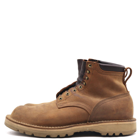 A single brown leather lace-up work boot with a pull tab and metal eyelets, shown in a side profile on a white background.