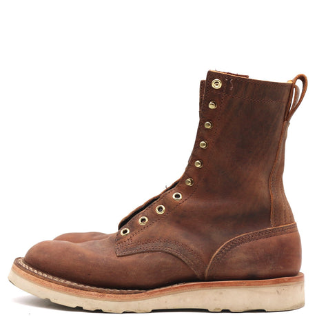 A single brown leather lace-up boot with brass eyelets and a thick off-white sole, shown in a side profile on a white background.