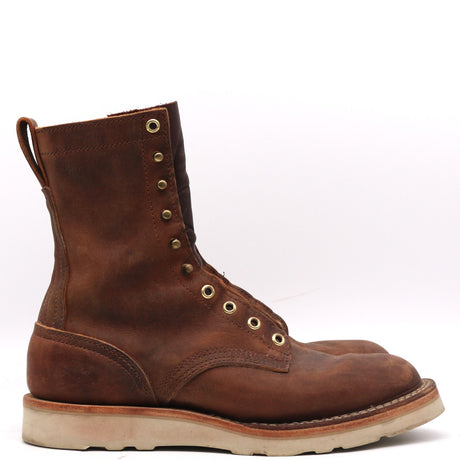 A single brown leather lace-up ankle boot with brass eyelets and a thick light-colored sole, shown in profile against a white background.