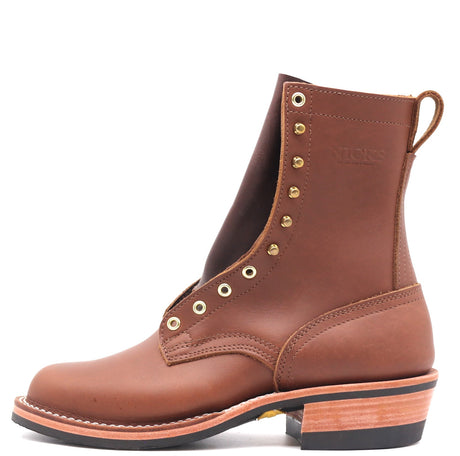 A brown leather ankle boot with gold-tone metal eyelets and studs, shown in a side profile on a white background.