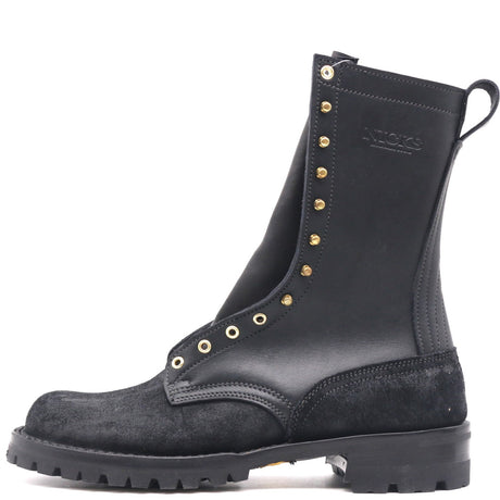 A black leather and suede mid-calf boot with gold-tone metal eyelets and studs, featuring a pull tab and a rugged sole, shown against a plain white background.