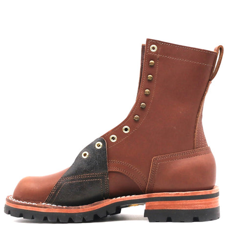 A brown leather lace-up work boot with a black leather toe overlay, brass eyelets, and a rugged black sole, shown from a side profile on a white background.