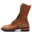 A brown leather lace-up boot with a rugged sole, featuring brass eyelets and studs, shown in a side profile on a white background.