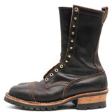 A dark brown leather lace-up boot with brass eyelets, a chunky wood-look heel, and a rugged black sole, shown from a side profile on a white background.