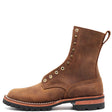 A brown suede lace-up ankle boot with brass eyelets, a pull tab, and a rugged black sole, shown from a side profile on a white background.