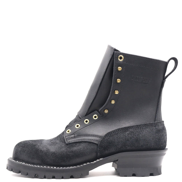 A black leather and suede lace-up ankle boot with gold-tone metal eyelets and studs, a pull tab, and a chunky lug sole, shown from a side profile on a white background.