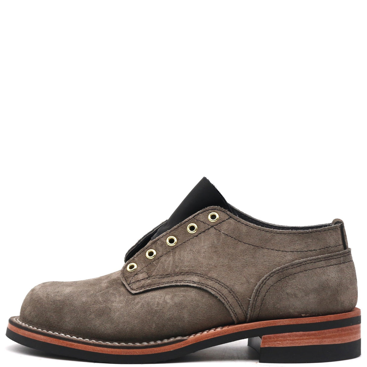 A single men's lace-up shoe in textured brown suede, featuring brass-tone eyelets, a black collar, and a stacked sole with a brown midsole and black outsole.