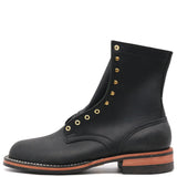 A black leather lace-up ankle boot with gold-tone metal eyelets and studs, shown from a side profile on a white background.