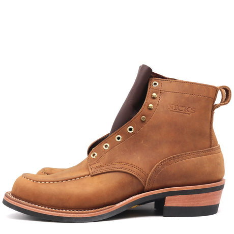 A single brown suede ankle boot with brass eyelets, a pull tab, and a stacked block heel, shown on a plain white background.