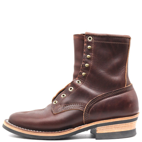 A dark brown leather lace-up ankle boot with brass eyelets and a stacked wood-and-ferrosofio heel, shown from a side profile on a white background.