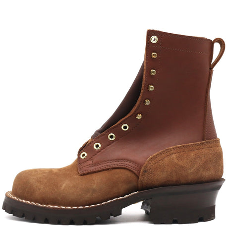A brown leather lace-up ankle boot with a brown suede toe and heel, featuring brass eyelets and a black lug sole, shown from a side profile on a white background.