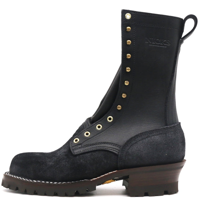 A black leather and suede lace-up ankle boot with gold-tone metal eyelets and studs, a pull tab, and a chunky brown lug sole, shown against a plain white background.