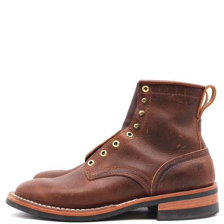 A single brown leather lace-up ankle boot with brass eyelets and a pull loop, shown in profile against a plain white background.