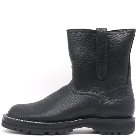 A single black leather ankle boot with a pebbled texture, a pull tab on the back, and a rugged sole, shown against a plain white background.