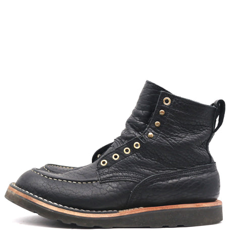 A single black leather lace-up ankle boot with gold-tone metal eyelets and stitching, shown from a side profile on a white background.