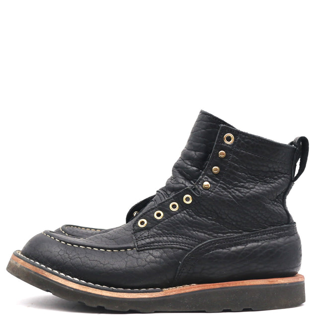 A single black leather lace-up ankle boot with gold-tone metal eyelets and stitching, shown from a side profile on a white background.