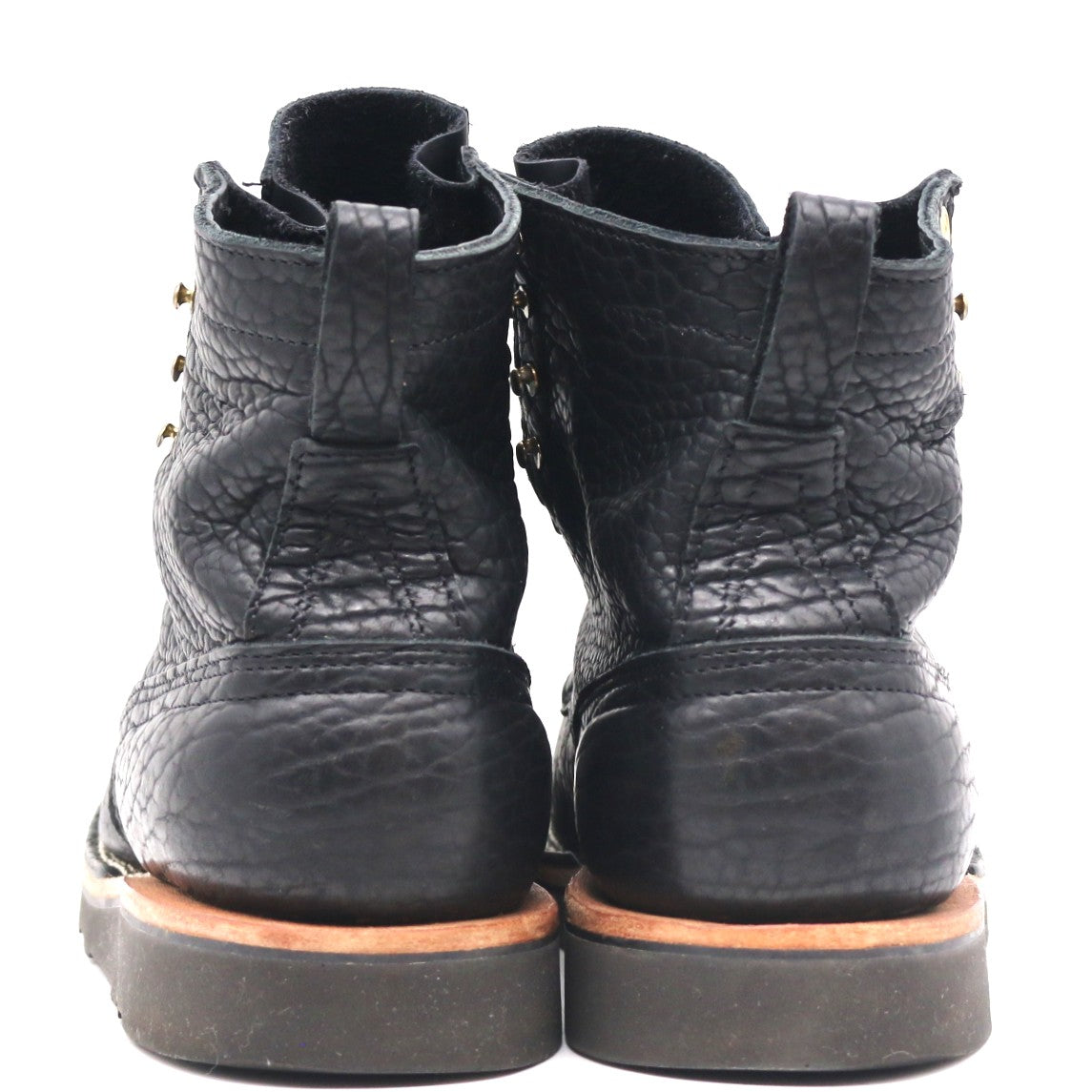 A pair of black leather ankle boots with a textured, cracked finish, shown from the back against a plain white background.