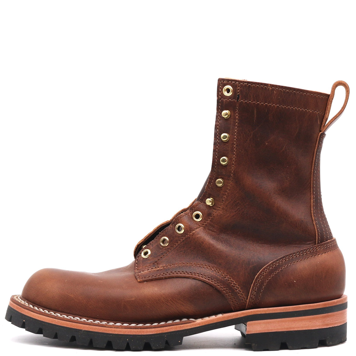 A brown leather lace-up boot with brass eyelets, a pull tab, and a rugged black sole, shown from a side profile on a white background.